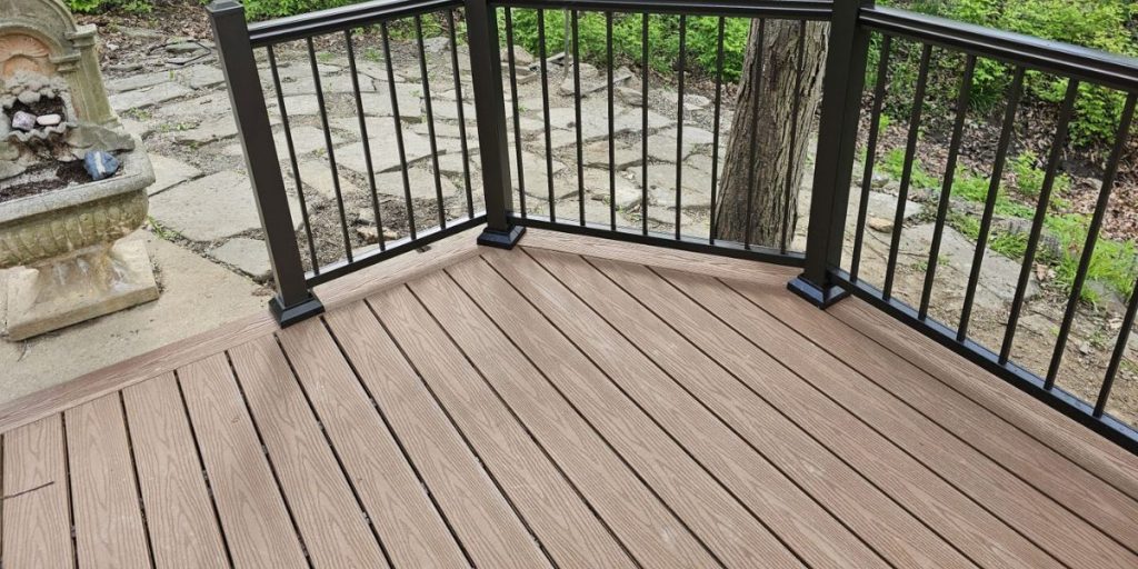 Sample deck material boards displaying wood, composite, and PVC decking options | Types of Deck Materials